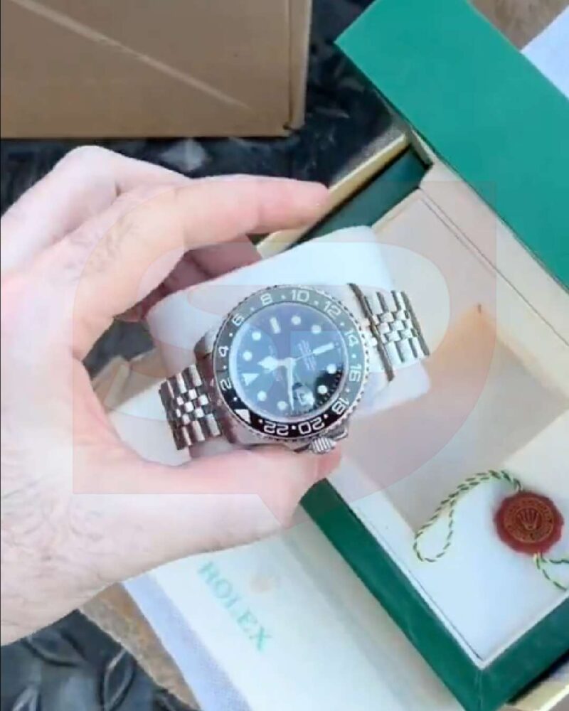 rolex watch sidewalk france riots 3